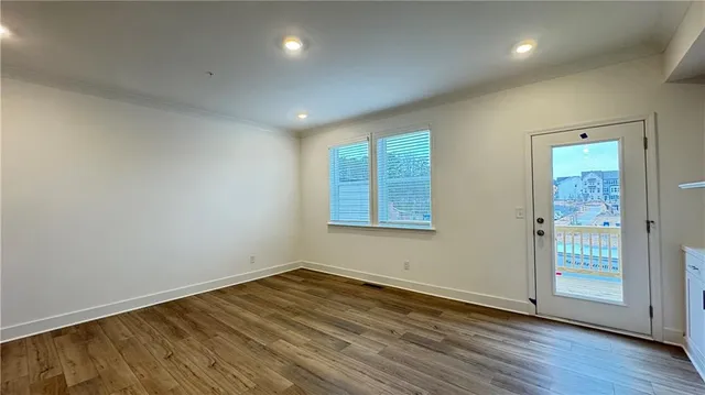a view of staircase with white walls and railing