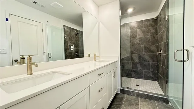 a white toilet sitting next to a bathroom sink