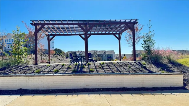 a view of a swimming pool with outdoor seating