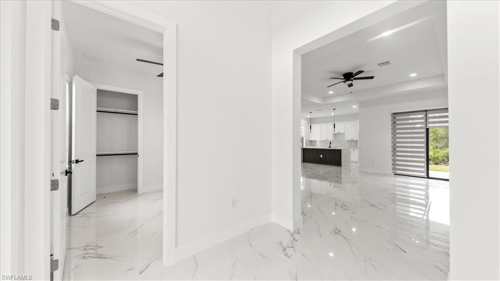 766 Roma Avenue South Lehigh Acres, FL 33974 - Photo 19 of 50 a view of a hallway with a bedroom