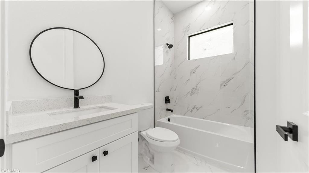 766 Roma Avenue South Lehigh Acres, FL 33974 - Photo 22 of 50 a bathroom with a sink toilet and shower