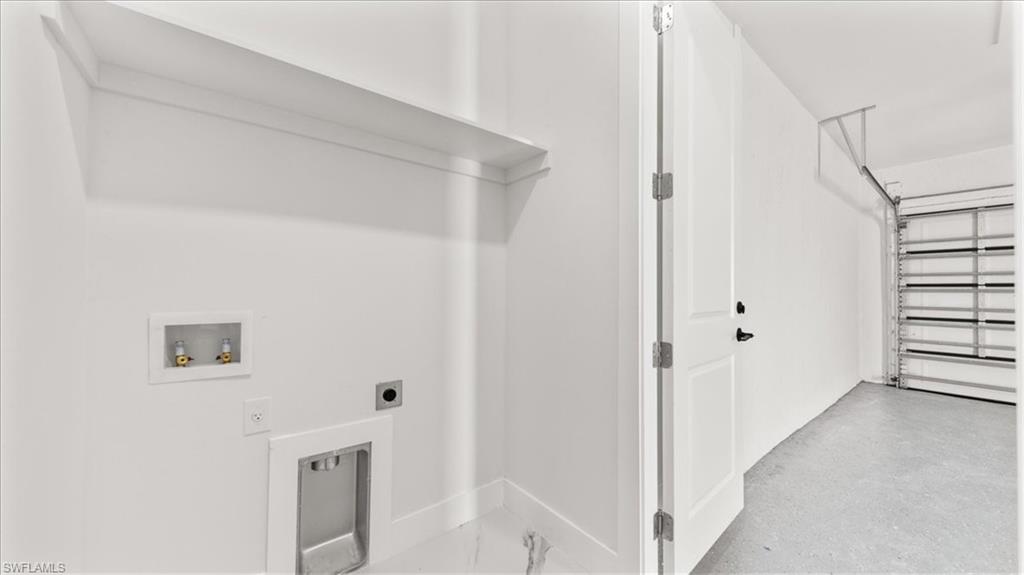 766 Roma Avenue South Lehigh Acres, FL 33974 - Photo 32 of 50 a view of a hallway with elevator