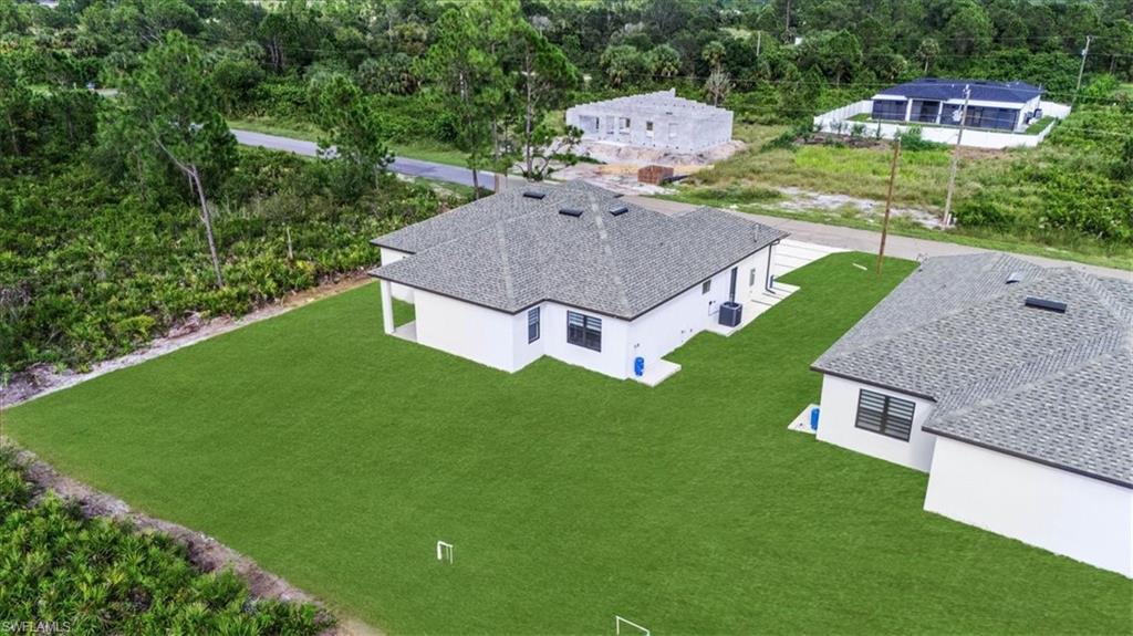 766 Roma Avenue South Lehigh Acres, FL 33974 - Photo 42 of 50 an aerial view of a house