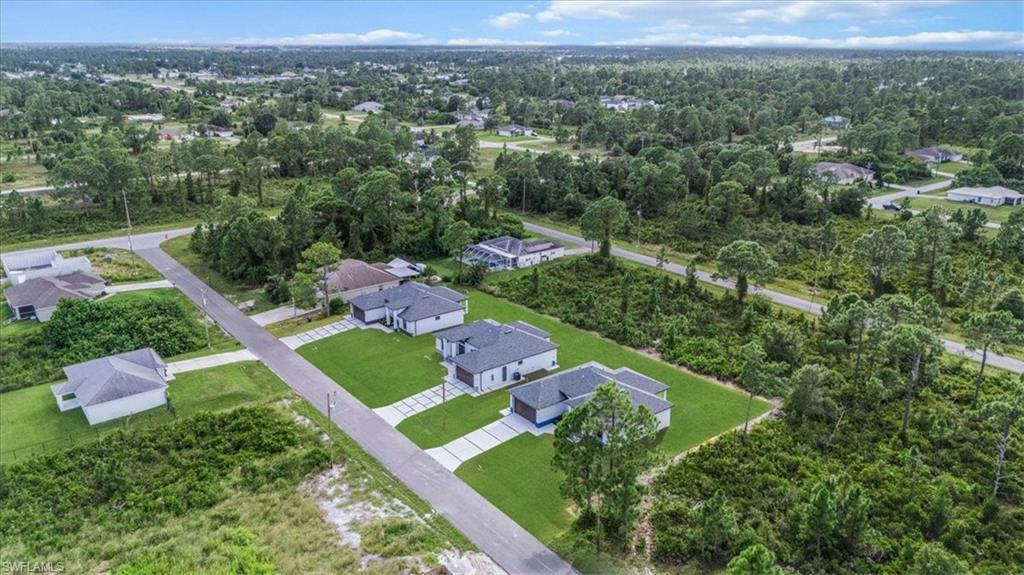 766 Roma Avenue South Lehigh Acres, FL 33974 - Photo 43 of 50 an aerial view of a house with a yard