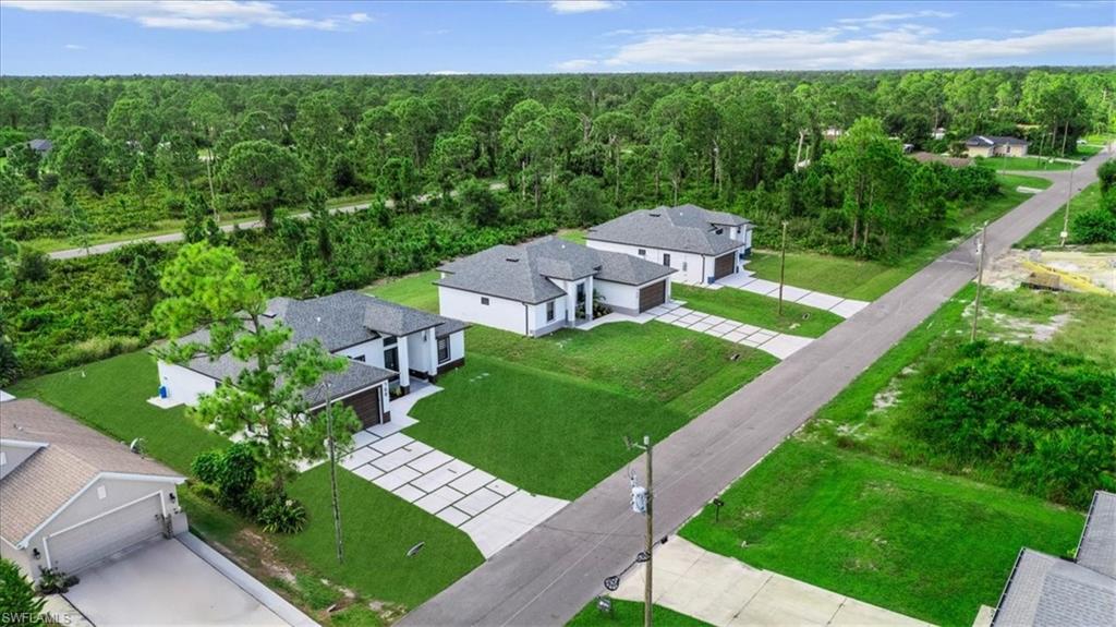 766 Roma Avenue South Lehigh Acres, FL 33974 - Photo 47 of 50 a view of a house with a yard