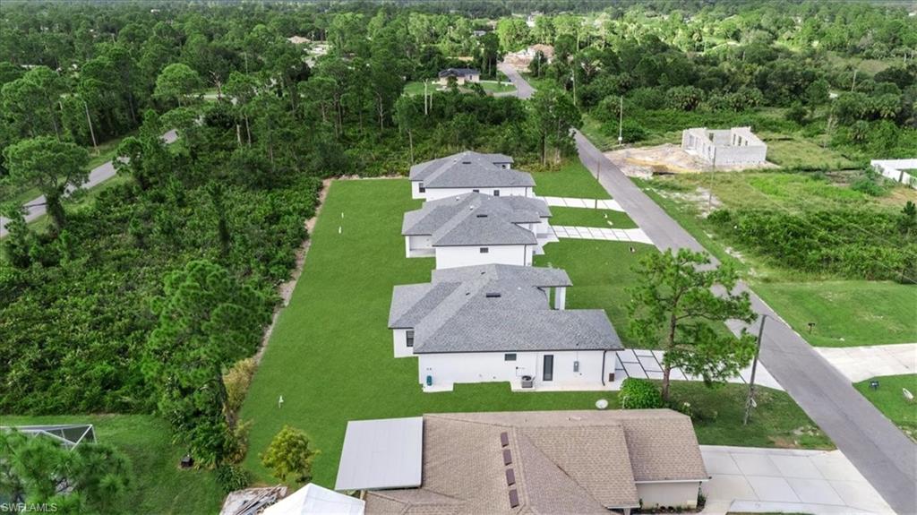 766 Roma Avenue South Lehigh Acres, FL 33974 - Photo 49 of 50 an aerial view of a house