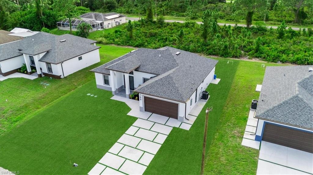 766 Roma Avenue South Lehigh Acres, FL 33974 - Photo 8 of 50 an aerial view of a house