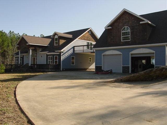 997 Burnett Ferry Road Southwest Rome, GA 30165 - Photo 1 of 1 a view of a house with a yard
