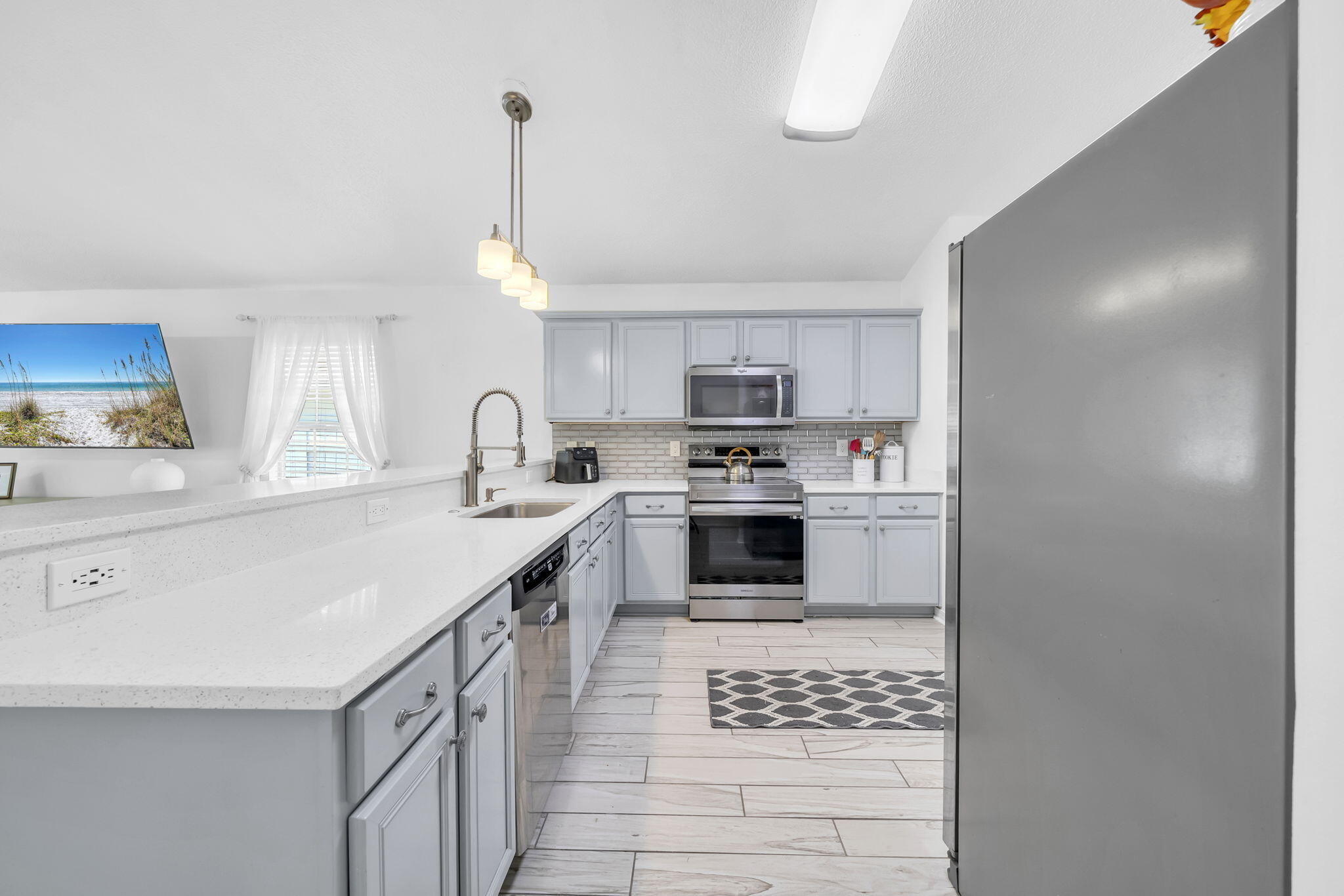 119 Red Bay Court Santa Rosa Beach, FL 32459 - Photo 16 of 36 a kitchen with granite countertop a sink stainless steel appliances and cabinets