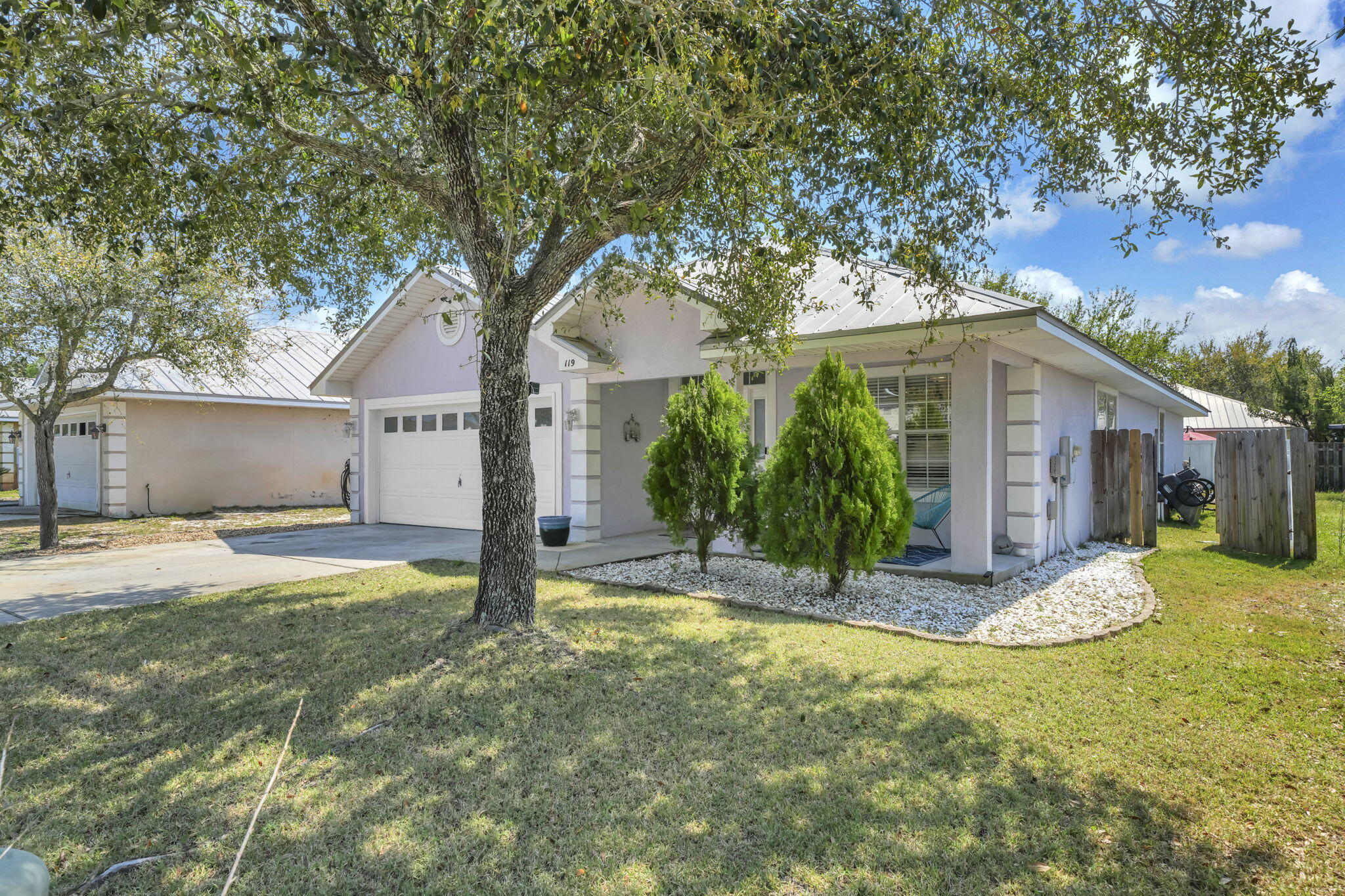 119 Red Bay Court Santa Rosa Beach, FL 32459 - Photo 2 of 36 a front view of house with yard and trees in the background