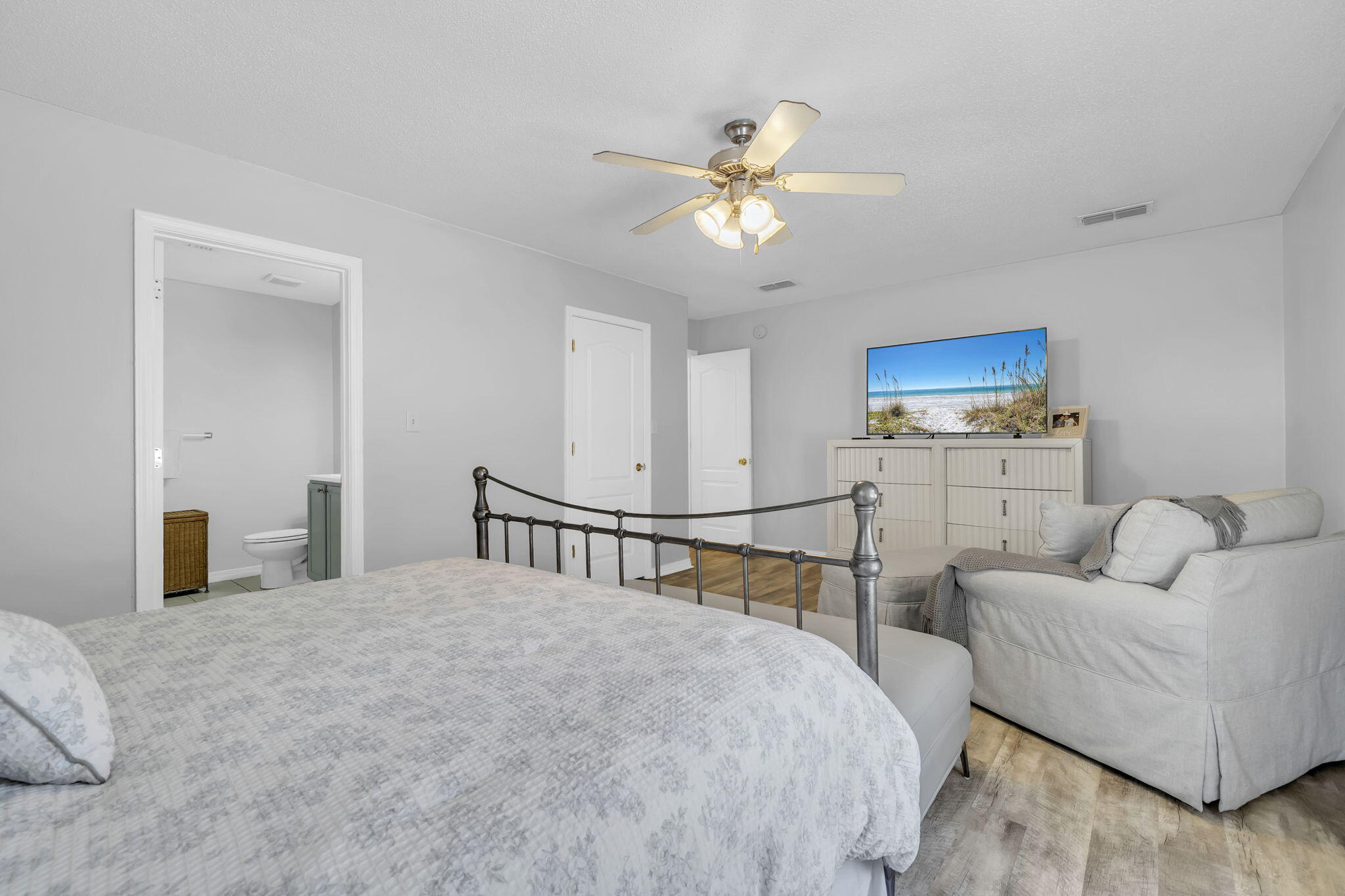 119 Red Bay Court Santa Rosa Beach, FL 32459 - Photo 20 of 36 a bedroom with a bed couches and flat screen tv