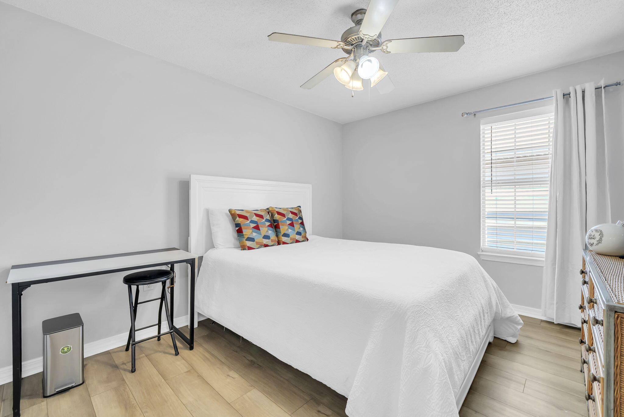 119 Red Bay Court Santa Rosa Beach, FL 32459 - Photo 23 of 36 a bedroom with a bed and a chandelier