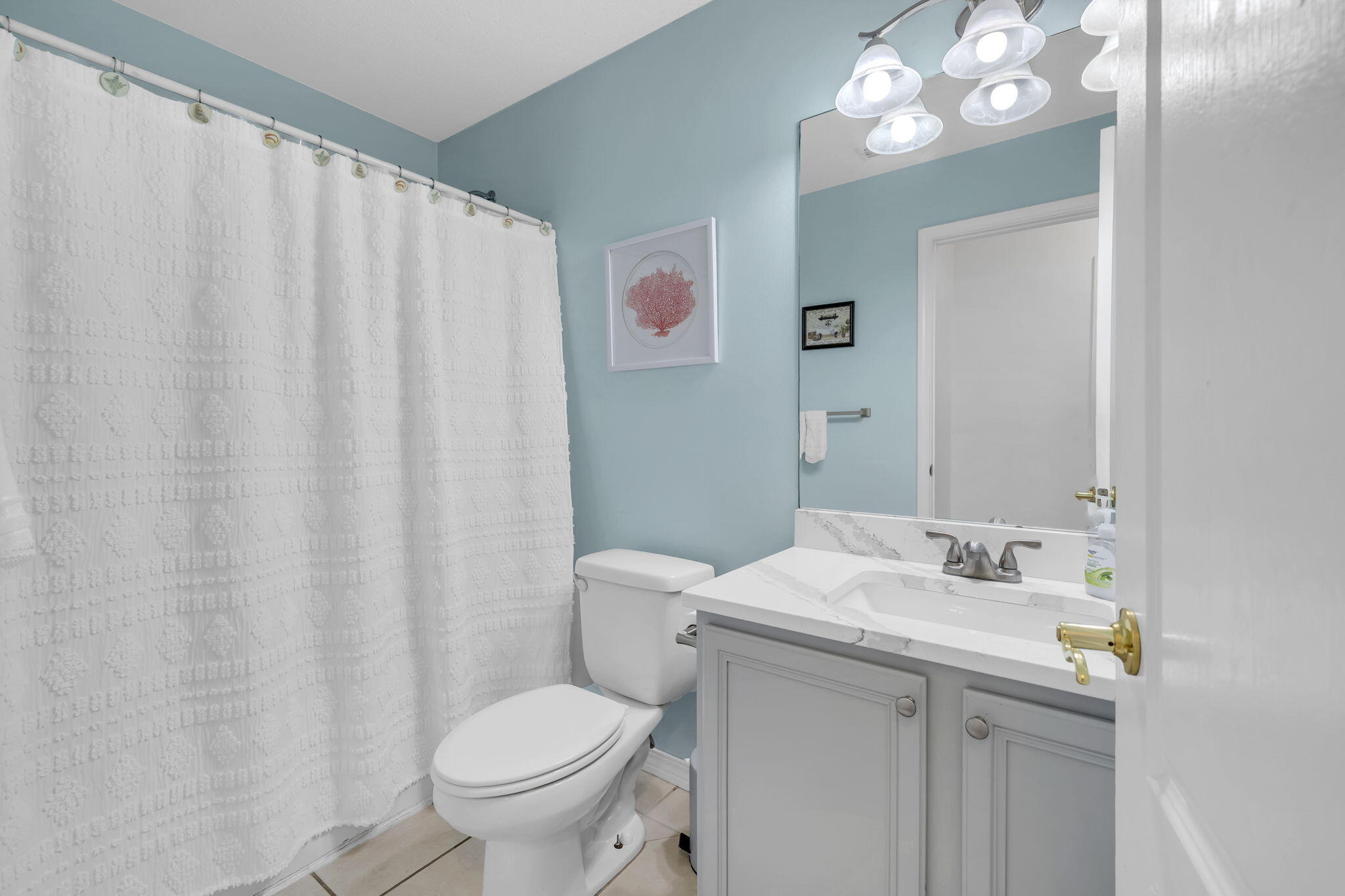 119 Red Bay Court Santa Rosa Beach, FL 32459 - Photo 25 of 36 a bathroom with a granite countertop sink a toilet and a mirror