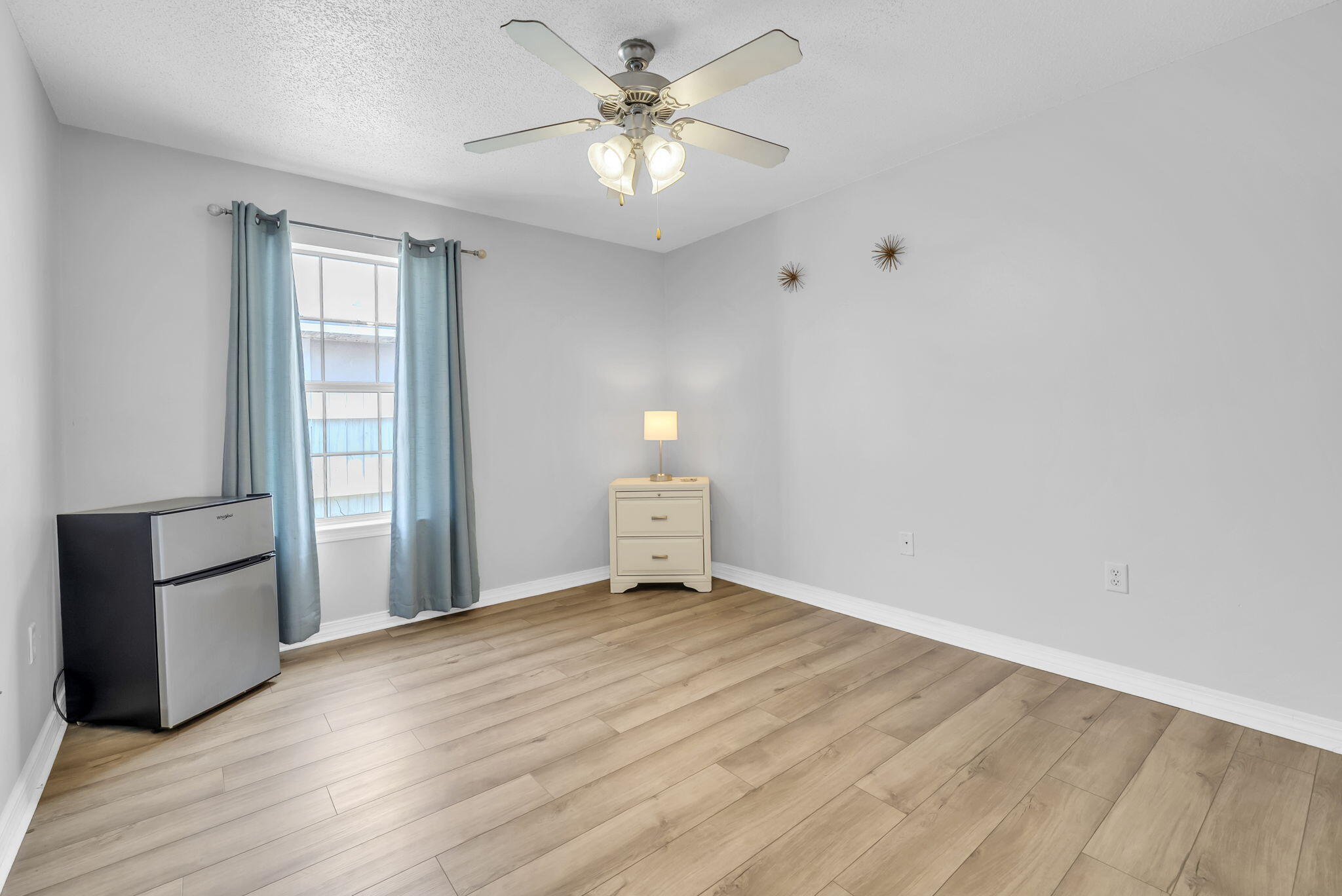 119 Red Bay Court Santa Rosa Beach, FL 32459 - Photo 26 of 36 a view of empty room with wooden floor and fan
