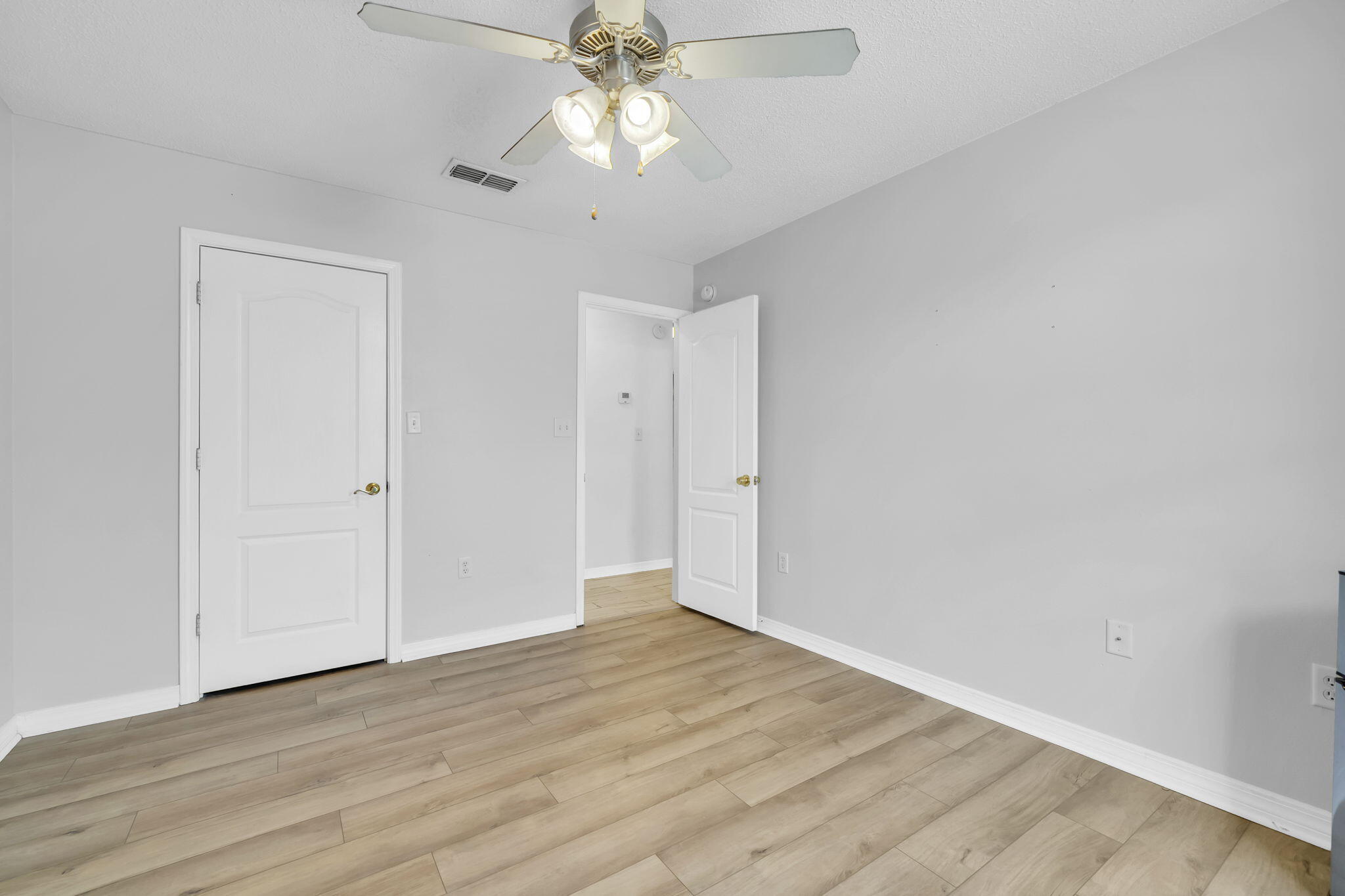119 Red Bay Court Santa Rosa Beach, FL 32459 - Photo 27 of 36 a view of an empty room with wooden floor