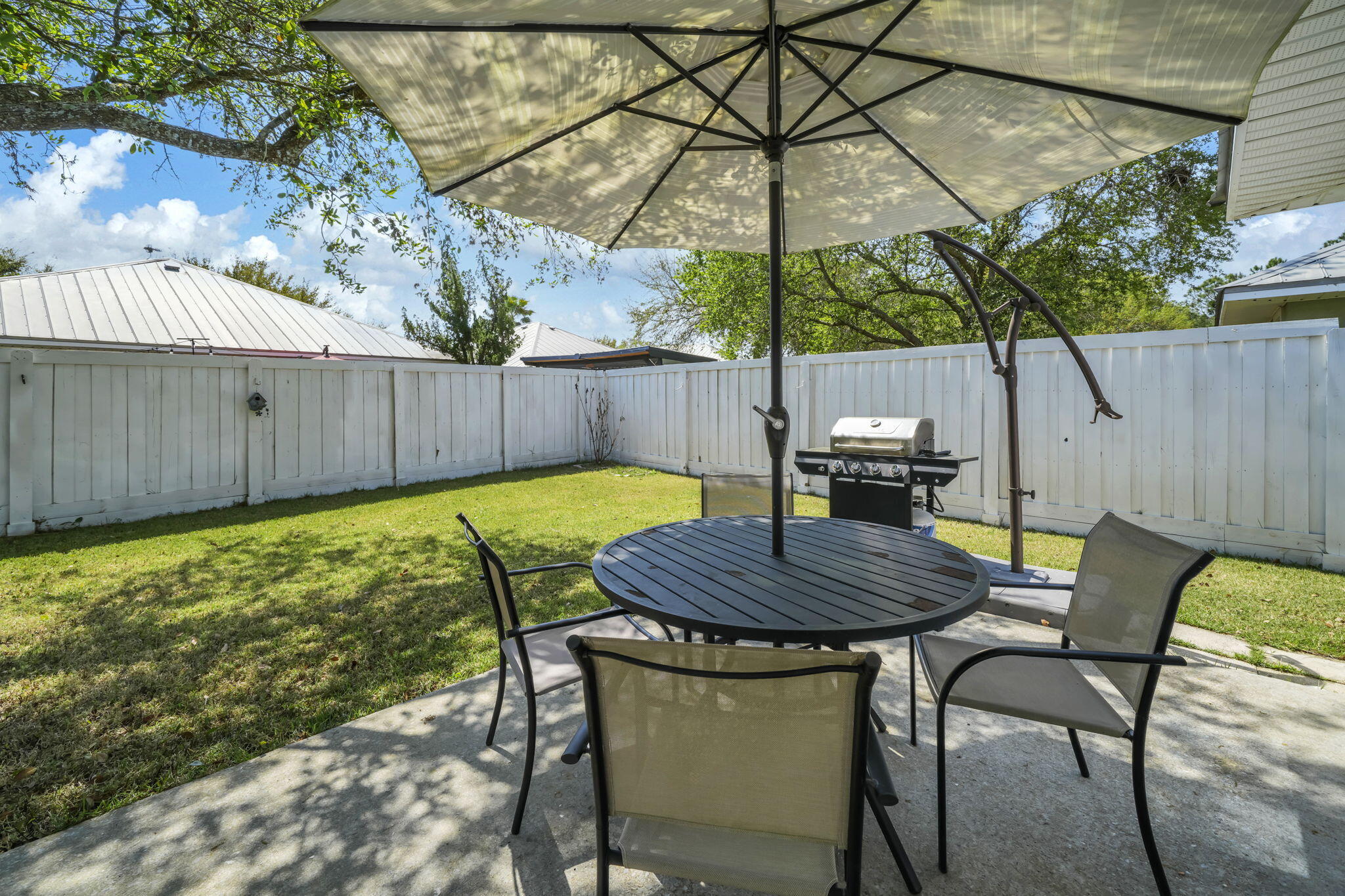 119 Red Bay Court Santa Rosa Beach, FL 32459 - Photo 30 of 36 a view of outdoor sitting area with furniture and umbrella