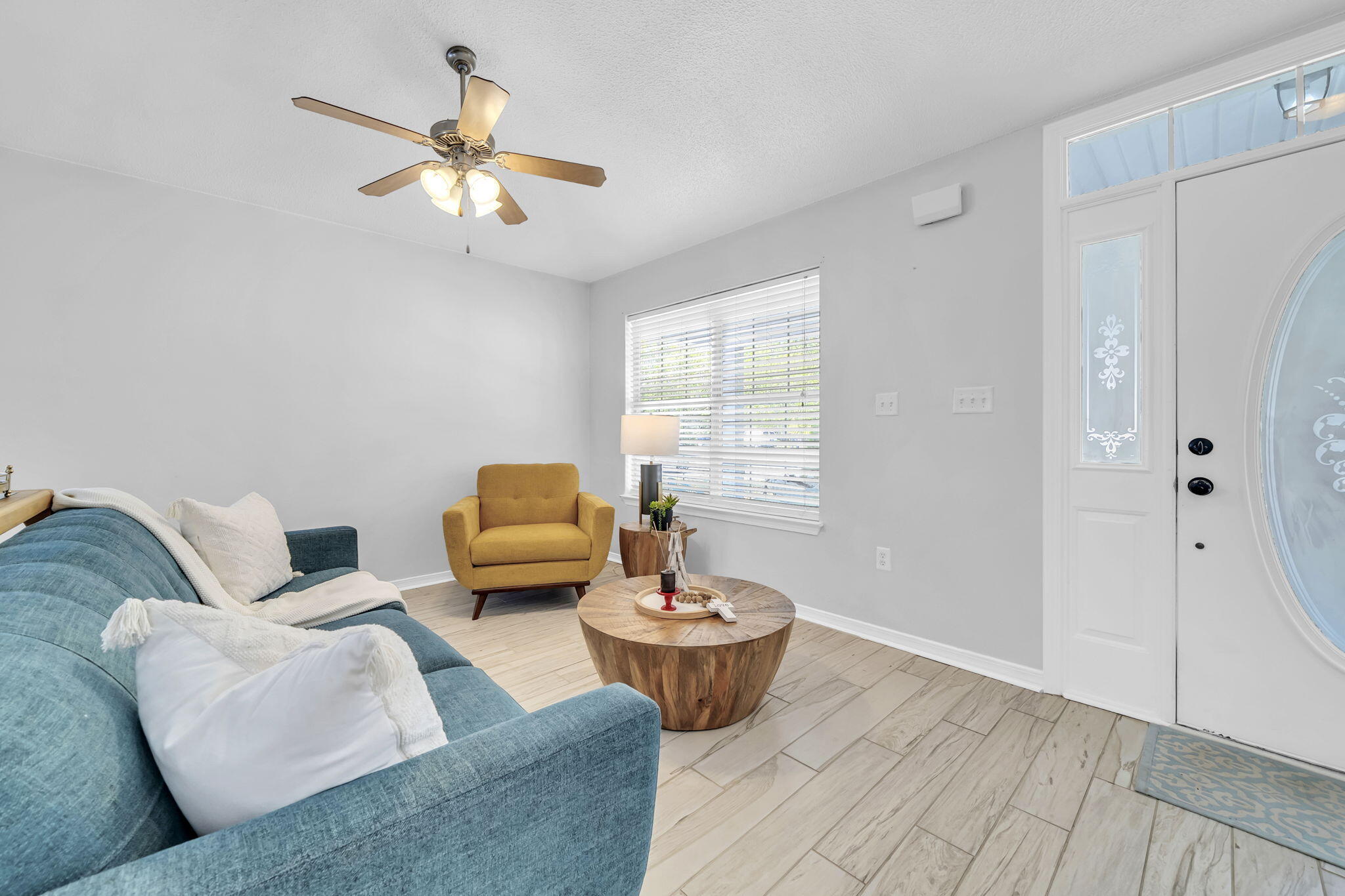 119 Red Bay Court Santa Rosa Beach, FL 32459 - Photo 5 of 36 a living room with furniture and a chandelier