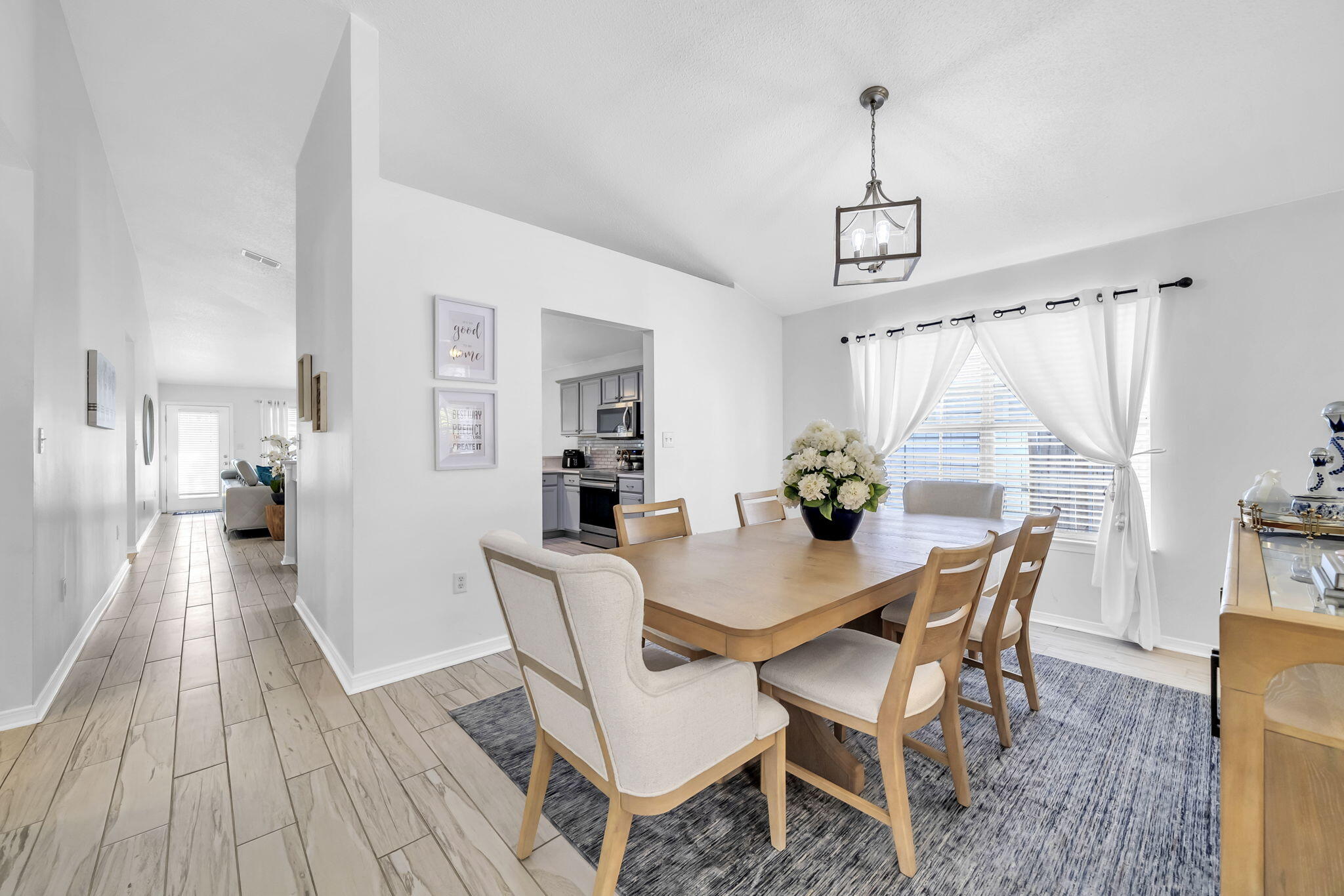119 Red Bay Court Santa Rosa Beach, FL 32459 - Photo 8 of 36 a view of a dining room with furniture window and wooden floor