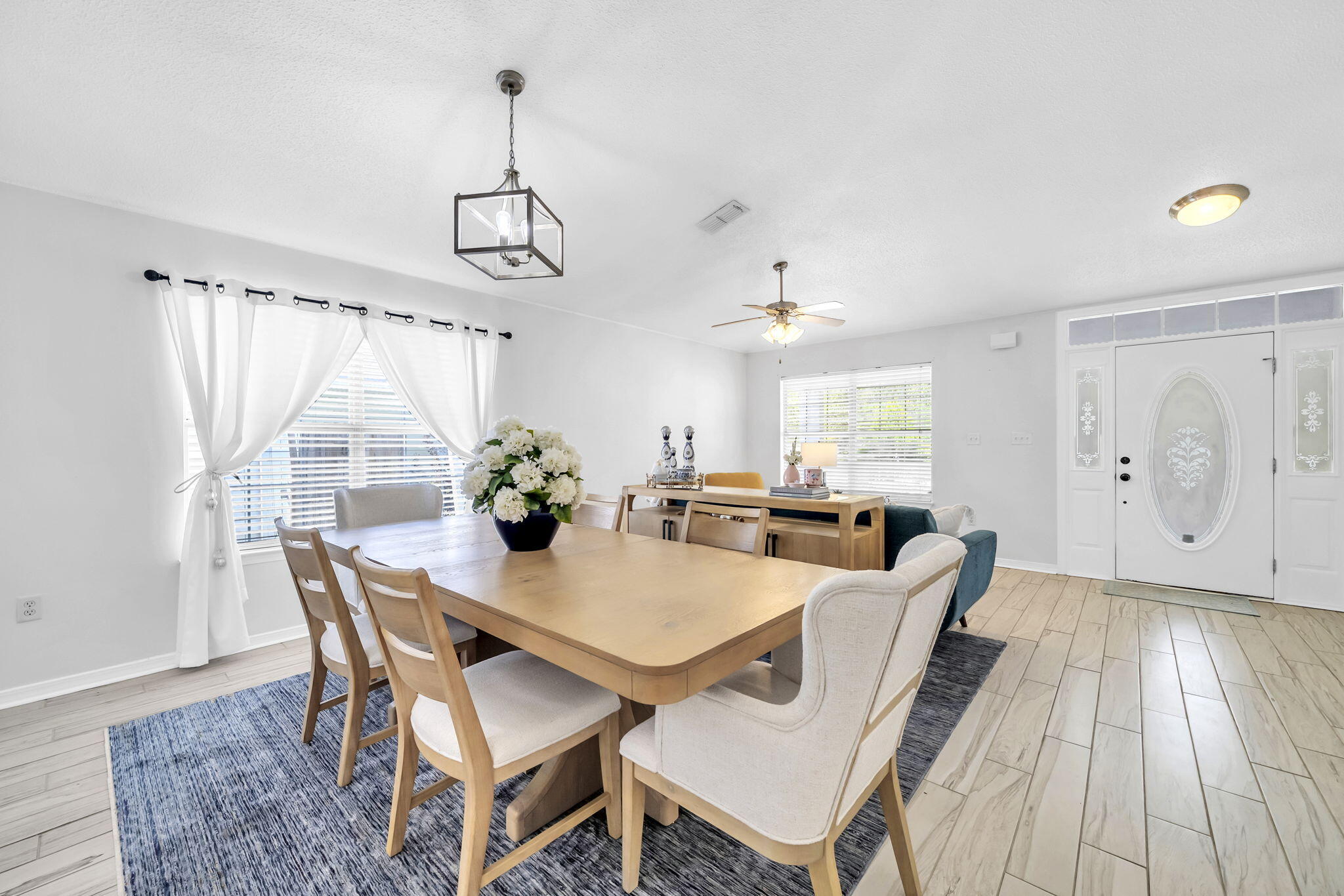 119 Red Bay Court Santa Rosa Beach, FL 32459 - Photo 9 of 36 a view of a dining room with furniture window and wooden floor