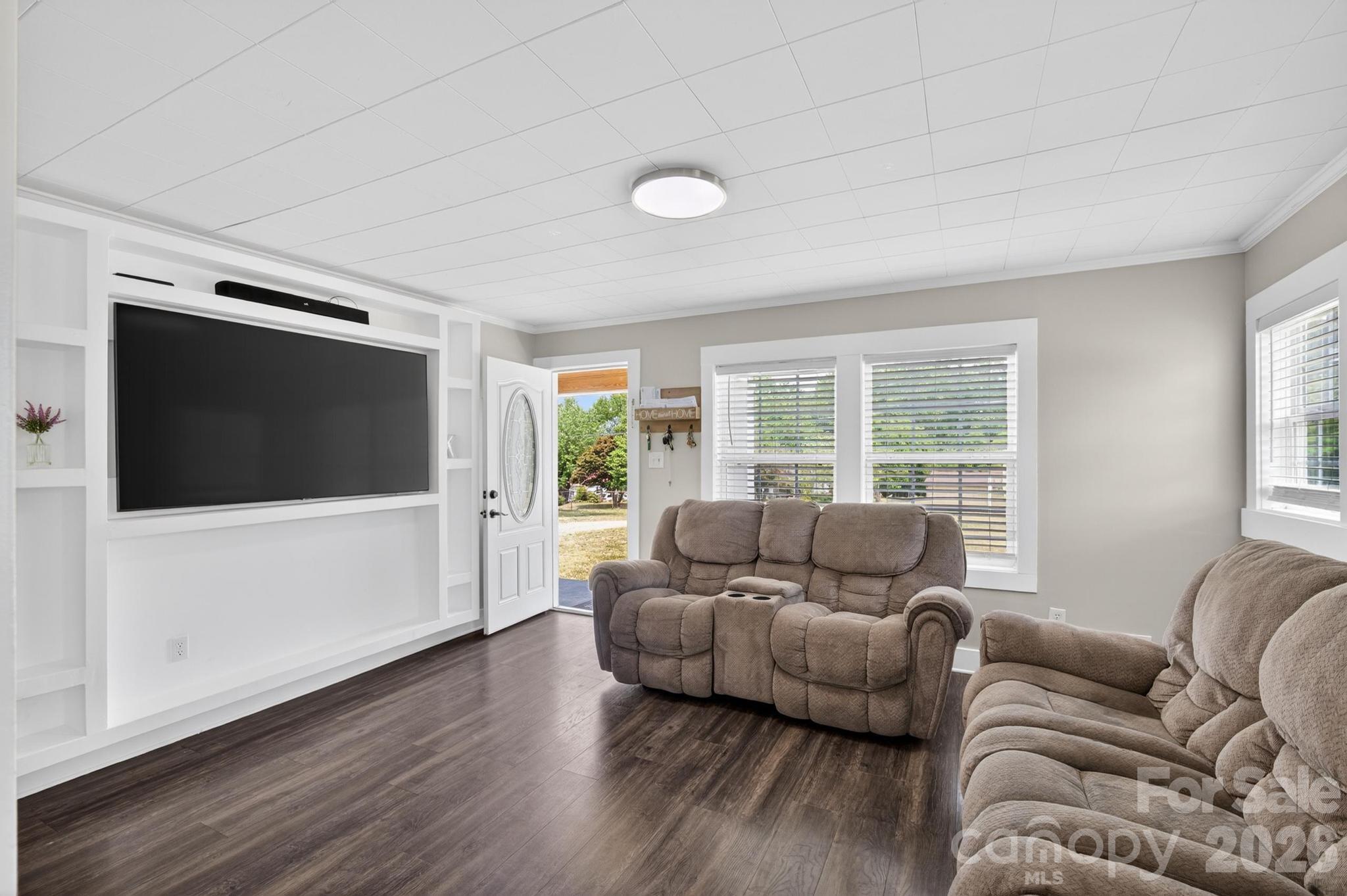 2076 Connelly Springs Road Lenoir, NC 28645 - Photo 8 of 47 a living room with furniture and a flat screen tv
