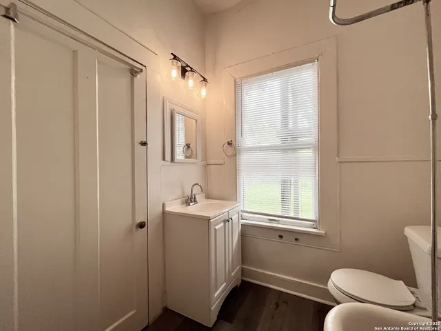 an empty room with wooden floor