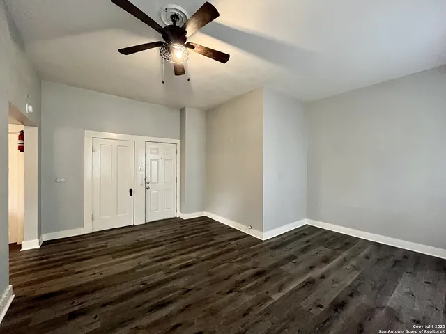 a view of a refrigerator in kitchen and wooden floor