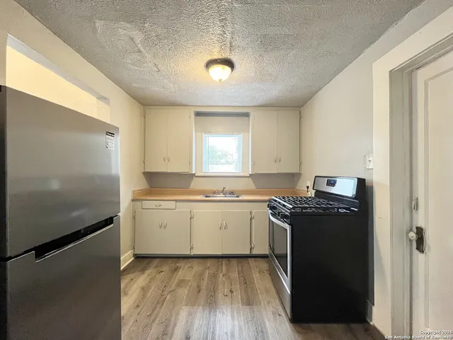 a view of a livingroom from a hallway