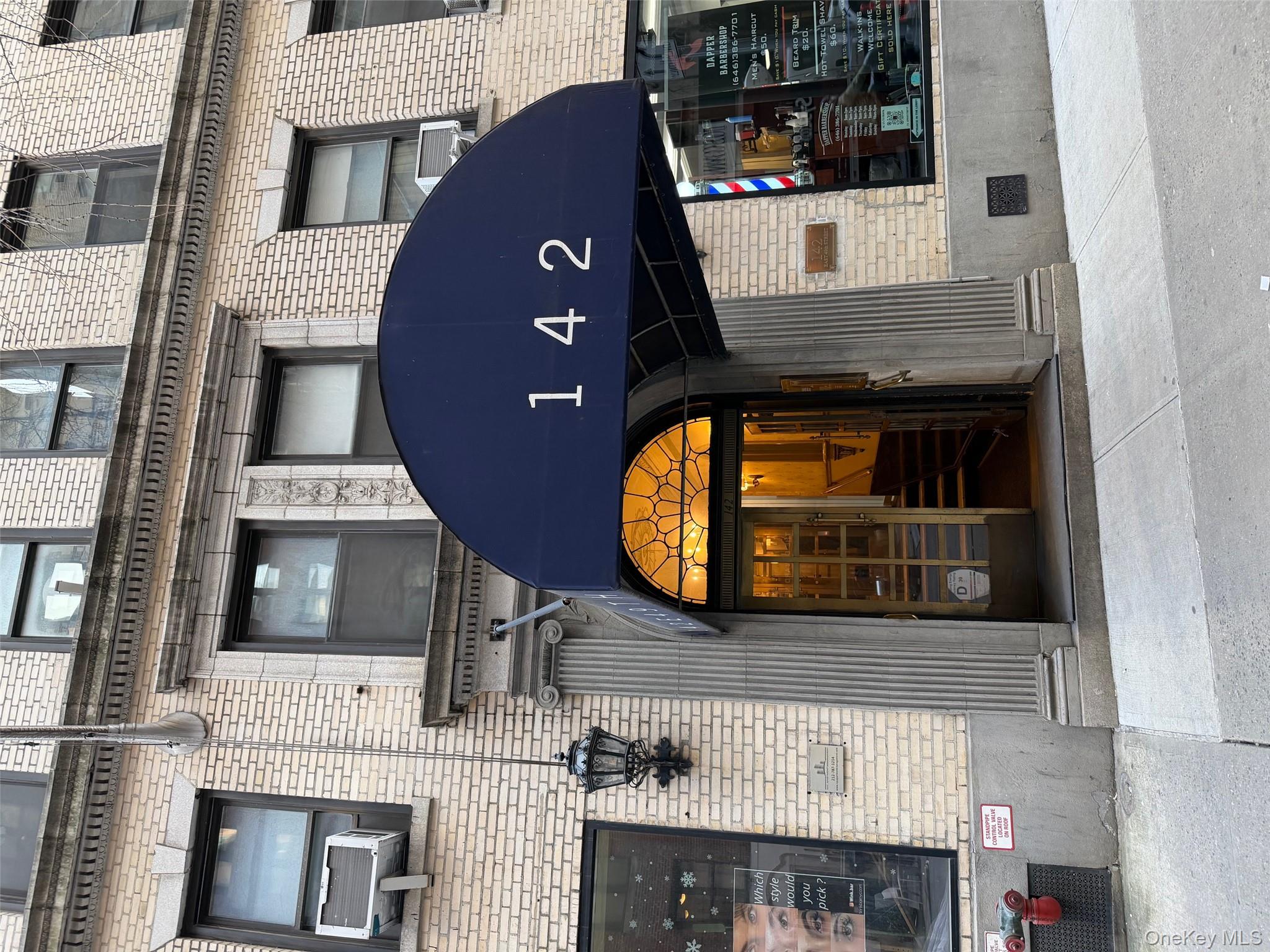 142 East 49th Street, Unit 8A Manhattan, NY 10017 - Photo 2 of 12 a building view with a outdoor space