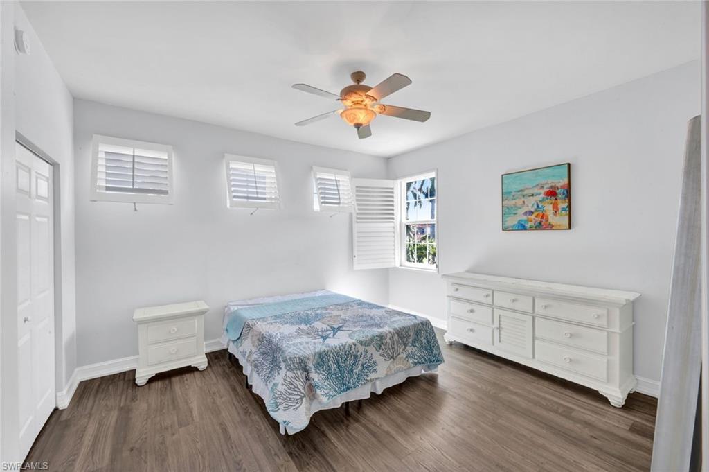 1277 Rialto Way, Unit 201 Naples, FL 34114 - Photo 18 of 46 a bedroom with a bed and a window