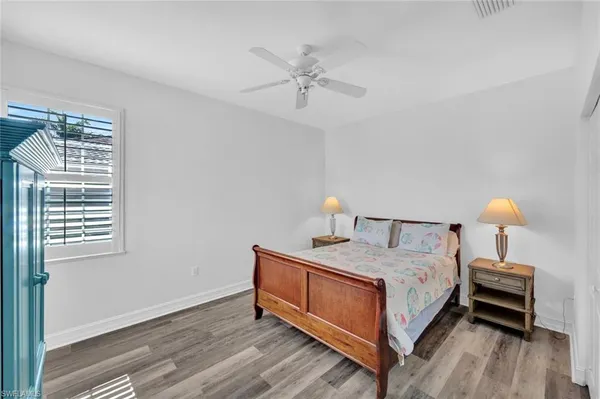 a bedroom with a bed and a table