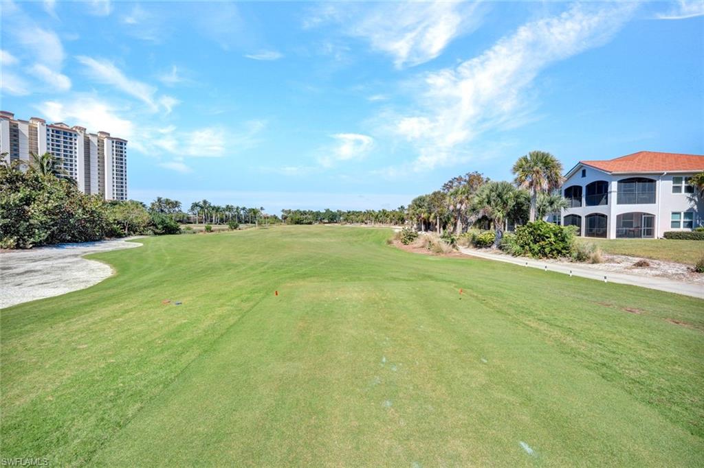 1277 Rialto Way, Unit 201 Naples, FL 34114 - Photo 22 of 46 a view of a garden with houses