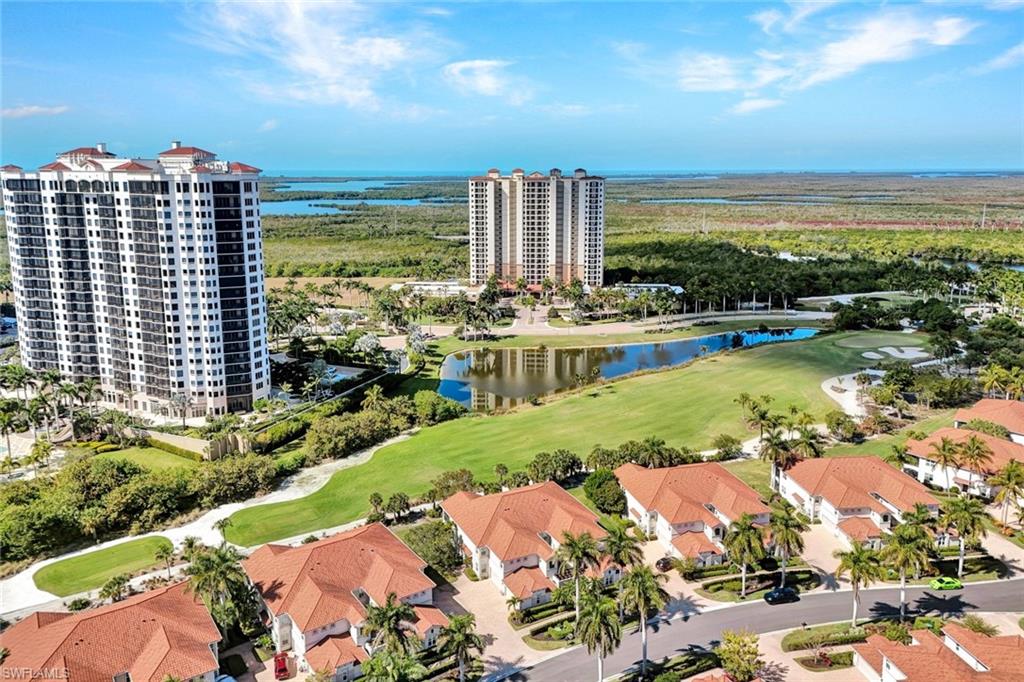 1277 Rialto Way, Unit 201 Naples, FL 34114 - Photo 24 of 46 a view of a city with tall buildings