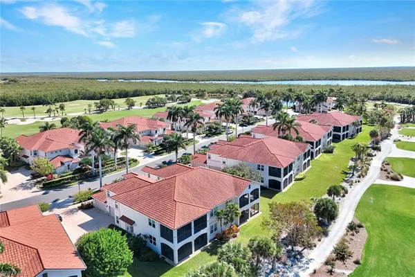 an aerial view of house with yard swimming pool and outdoor seating