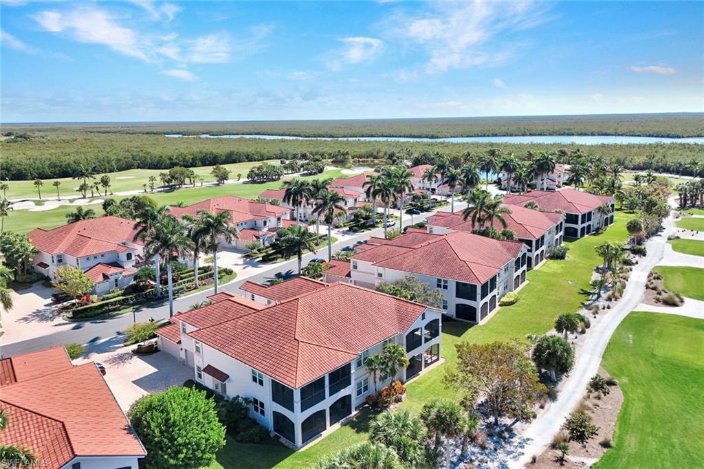 1277 Rialto Way, Unit 201 Naples, FL 34114 - Photo 28 of 46 an aerial view of residential houses with outdoor space
