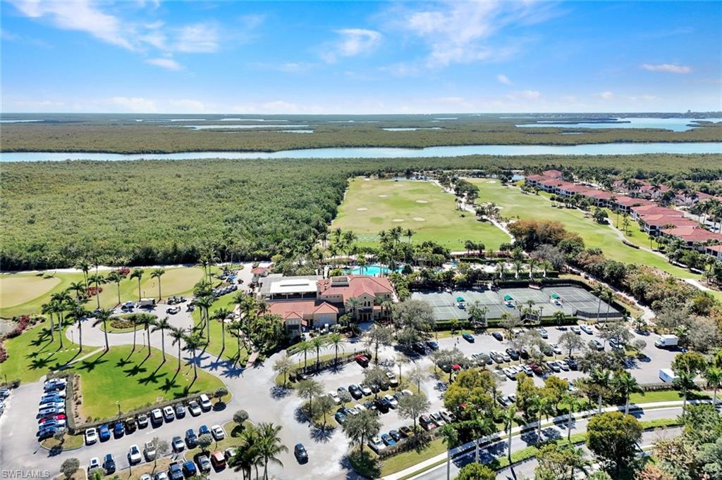 1277 Rialto Way, Unit 201 Naples, FL 34114 - Photo 38 of 46 a view of an ocean and beach