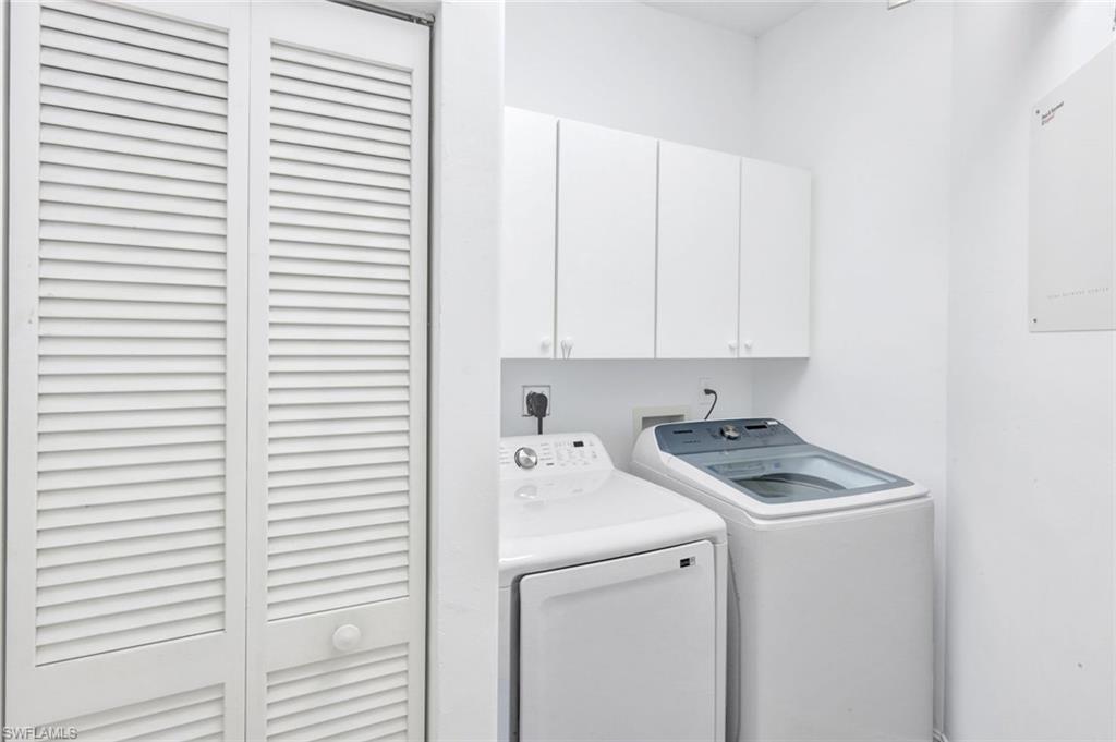 1277 Rialto Way, Unit 201 Naples, FL 34114 - Photo 46 of 46 a utility room with dryer and washer