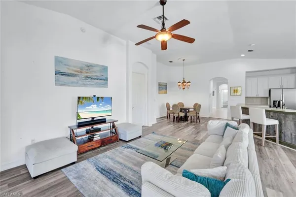 a living room with furniture and a flat screen tv