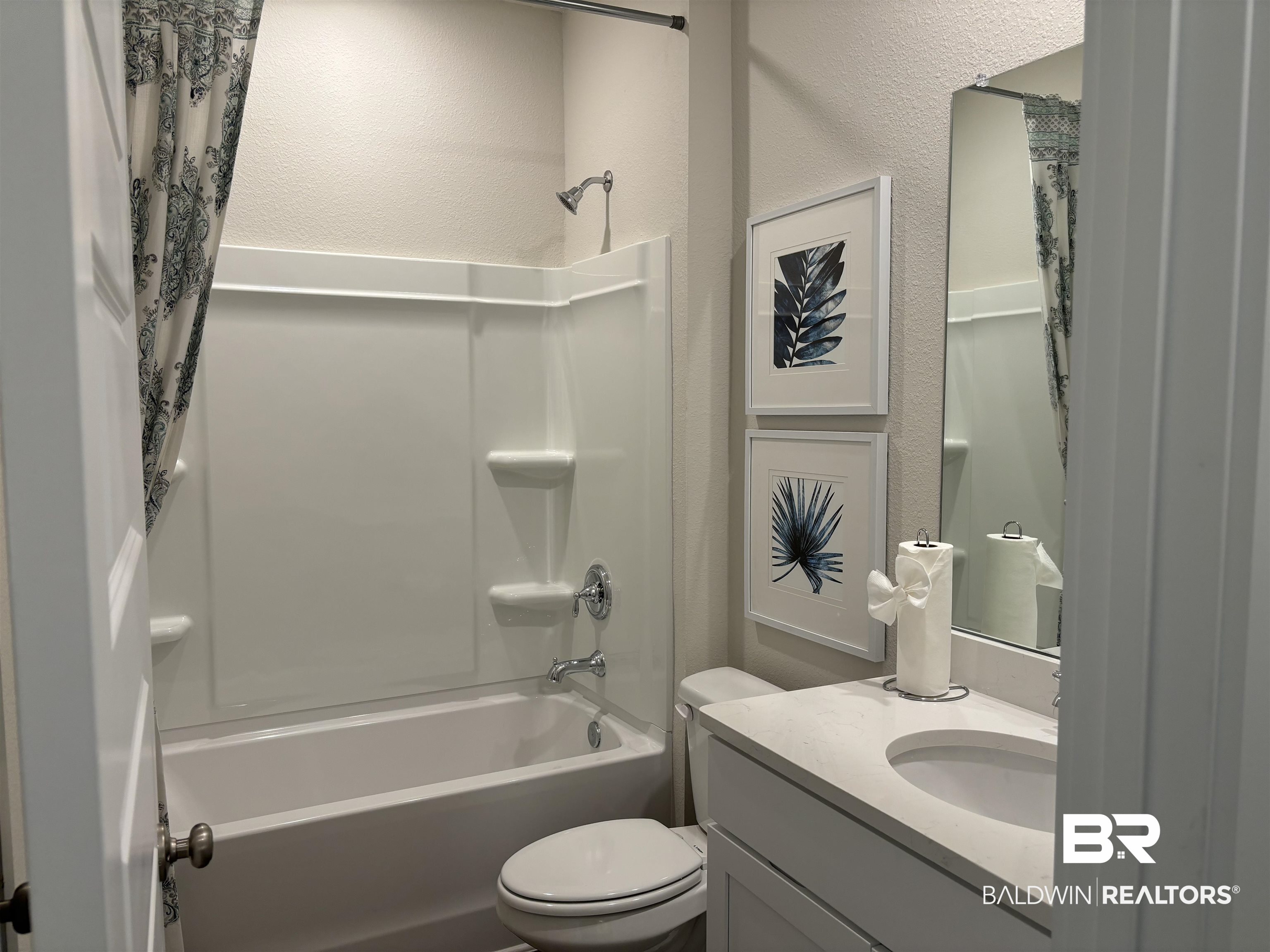 370 Barndling Street Fairhope, AL 36532 - Photo 26 of 30 Full bathroom featuring toilet, vanity, and shower / bath combo with shower curtain