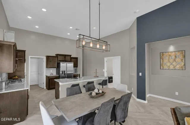a view of a dining room with furniture wooden floor and chandelier