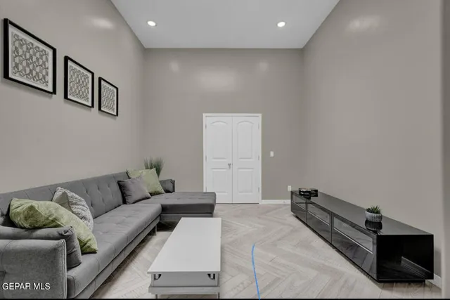 a bedroom with a bed a mirror and a window