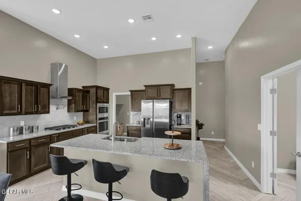 a kitchen with counter space cabinets and appliances