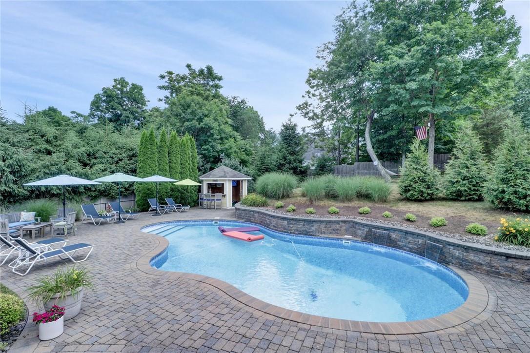 Paradise right in your own backyard!  This is the TRIFECTA - Move-in ready condition inside and out, great schools and backyard oasis!  Heated saltwater pool with cabana, magnificent landscaping, lots of additional property for recreational activities and multiple lounge areas!