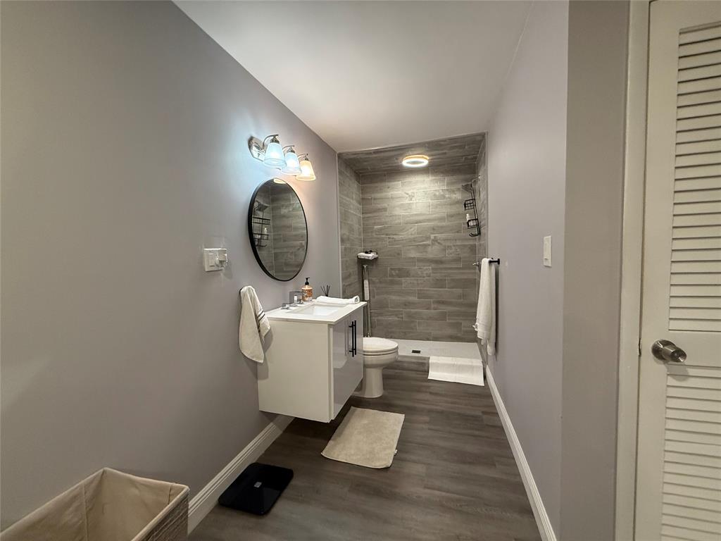 20862 Vinesta Circle Boca Raton, FL 33433 - Photo 13 of 19 a view of a bathroom with a sink and a mirror