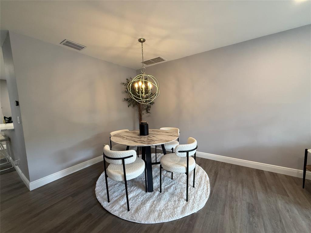 20862 Vinesta Circle Boca Raton, FL 33433 - Photo 8 of 19 a view of a dining room with a table and chairs