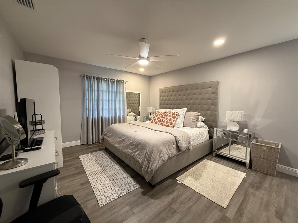 20862 Vinesta Circle Boca Raton, FL 33433 - Photo 10 of 19 a bedroom with a large bed and a flat screen tv