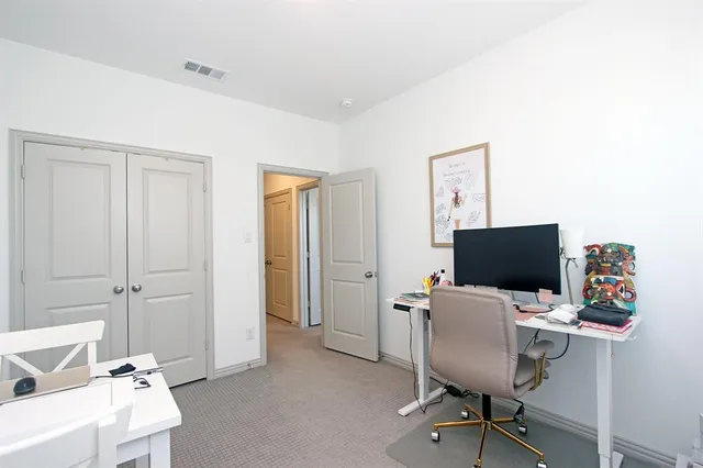 a view of a refrigerator in a kitchen