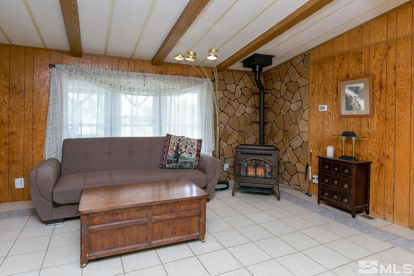 3057 Casey Road Fallon, NV 89406 - Photo 9 of 33 a living room with furniture and a fireplace