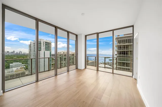 a bathroom with a double vanity sink a mirror and shower