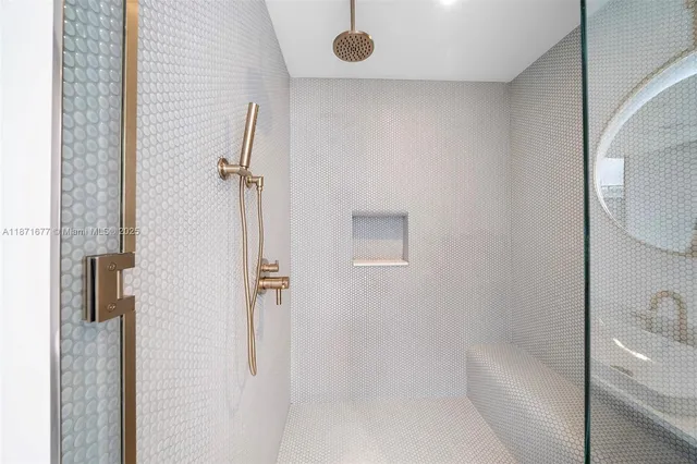 a bedroom with two beds and a large window