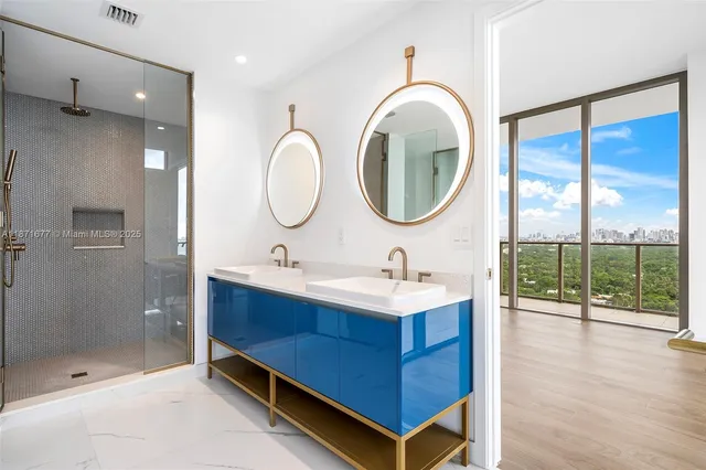 a bathroom with a double vanity sink and mirror